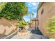 Side yard with palm trees and a stone patio at 6713 E Paradise Ln, Scottsdale, AZ 85254