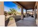 Landscaped backyard with a grassy area and covered patio at 7578 W Keim Dr, Glendale, AZ 85303