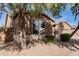 House exterior showcasing a large window and mature trees at 7578 W Keim Dr, Glendale, AZ 85303