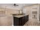 Modern kitchen with granite countertops and dark wood cabinets at 7578 W Keim Dr, Glendale, AZ 85303