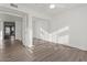 Bedroom with mirrored closet and wood-look floors at 9396 E Purdue Ave # 120, Scottsdale, AZ 85258