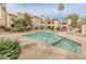 Community pool and spa with lounge chairs at 9396 E Purdue Ave # 120, Scottsdale, AZ 85258