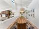 Elegant dining room with a large wooden table and statement lighting at 1028 W Indian Hills Pl, Phoenix, AZ 85023