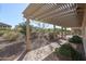 Landscaped backyard with pergola and patio at 17547 W Silver Fox Way, Goodyear, AZ 85338