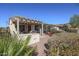 Landscaped backyard with pergola and grill at 17547 W Silver Fox Way, Goodyear, AZ 85338