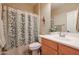 Bathroom with single vanity and shower/tub combo at 17547 W Silver Fox Way, Goodyear, AZ 85338