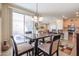 Charming dining area with sliding door access to a patio at 17547 W Silver Fox Way, Goodyear, AZ 85338