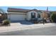 Single-story home with a two-car garage and desert landscaping at 17547 W Silver Fox Way, Goodyear, AZ 85338