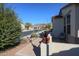 Small front patio with wrought iron furniture and a view of the street at 17547 W Silver Fox Way, Goodyear, AZ 85338