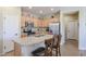Well-equipped kitchen with ample cabinetry and a granite island at 17547 W Silver Fox Way, Goodyear, AZ 85338