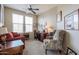 Home office with built-in desk and comfortable seating at 17547 W Silver Fox Way, Goodyear, AZ 85338