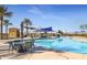 Resort-style outdoor pool with comfortable seating and shade structures at 17547 W Silver Fox Way, Goodyear, AZ 85338