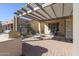 Outdoor kitchen and patio with seating area at 17547 W Silver Fox Way, Goodyear, AZ 85338