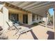 Covered patio with seating area, perfect for relaxing at 17547 W Silver Fox Way, Goodyear, AZ 85338