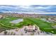 Aerial view of the golf course and community center with ample parking at 3055 N Red Mountain Mtn # 95, Mesa, AZ 85207