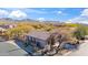 Stunning aerial view of a home with desert landscaping and tile roof in a picturesque neighborhood at 3055 N Red Mountain Mtn # 95, Mesa, AZ 85207