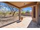 Relaxing covered back patio with tile flooring, perfect for outdoor entertaining and enjoying the backyard at 3055 N Red Mountain Mtn # 95, Mesa, AZ 85207