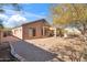 Desert landscaped backyard with patio, fire pit, and natural surroundings, creating a serene outdoor space at 3055 N Red Mountain Mtn # 95, Mesa, AZ 85207
