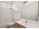 Bathroom featuring a bathtub/shower combo, toilet, and sink with vanity at 3055 N Red Mountain Mtn # 95, Mesa, AZ 85207