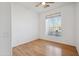 Well-lit bedroom with wood floors and large window overlooking the desert at 3055 N Red Mountain Mtn # 95, Mesa, AZ 85207