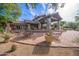 Exterior of the clubhouse with outdoor seating area and desert landscaping at 3055 N Red Mountain Mtn # 95, Mesa, AZ 85207