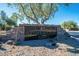 Boulder Mountain Parke sign with stone accents and mature trees in this beautiful and well-maintained community at 3055 N Red Mountain Mtn # 95, Mesa, AZ 85207