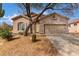 Charming single-story home with desert landscaping, attached garage, and neutral color palette at 3055 N Red Mountain Mtn # 95, Mesa, AZ 85207