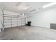 Spacious two car garage with ample room for parking and storage with a large garage door at 3055 N Red Mountain Mtn # 95, Mesa, AZ 85207