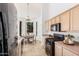 Bright kitchen showcasing appliances, a dining nook, and natural light at 3055 N Red Mountain Mtn # 95, Mesa, AZ 85207