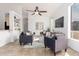Comfortable living area with tile floors, TV, ceiling fan, and stylish furnishings at 3055 N Red Mountain Mtn # 95, Mesa, AZ 85207