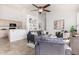 Stylish living room showcasing tile flooring, a ceiling fan, and modern furniture at 3055 N Red Mountain Mtn # 95, Mesa, AZ 85207