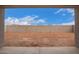 A spacious backyard with block wall offers a blank canvas for landscaping and outdoor living at 31465 N Wet Creek Rd, San Tan Valley, AZ 85143