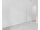 Bright bedroom offers neutral carpet, white walls, and a convenient door to the hallway at 31465 N Wet Creek Rd, San Tan Valley, AZ 85143