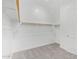 Bright walk-in closet features wood rods, overhead shelving, and neutral carpeting at 31465 N Wet Creek Rd, San Tan Valley, AZ 85143
