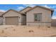 Charming single-story home with a two-car garage and low-maintenance desert landscaping at 31465 N Wet Creek Rd, San Tan Valley, AZ 85143