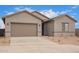 Charming single-story home with a two-car garage and low-maintenance desert landscaping at 31465 N Wet Creek Rd, San Tan Valley, AZ 85143