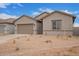 Charming single-story home with a two-car garage and low-maintenance desert landscaping at 31465 N Wet Creek Rd, San Tan Valley, AZ 85143