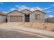 Charming single-story home with a two-car garage and low-maintenance desert landscaping at 31465 N Wet Creek Rd, San Tan Valley, AZ 85143