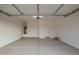 Spacious two-car garage with ample storage and a neutral color palette, ready for customization at 31465 N Wet Creek Rd, San Tan Valley, AZ 85143