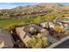 Aerial view of a house and community with mountain views at 41348 N Congressional Dr, Anthem, AZ 85086