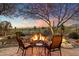 Relaxing backyard oasis with fire pit and seating area at 41348 N Congressional Dr, Anthem, AZ 85086