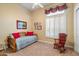 Charming bedroom with daybed and rocking chair at 41348 N Congressional Dr, Anthem, AZ 85086