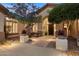 Elegant home exterior with landscaped courtyard, inviting entryway, and charming architectural details at 41348 N Congressional Dr, Anthem, AZ 85086