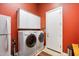 Bright laundry room with washer, dryer, and cabinets at 41348 N Congressional Dr, Anthem, AZ 85086