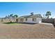 Artificial turf backyard with covered patio and gravel at 5240 E Tierra Buena Ln, Scottsdale, AZ 85254