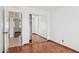 Well-lit bedroom with mirrored closet and wood floors at 5240 E Tierra Buena Ln, Scottsdale, AZ 85254