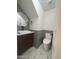 Modern powder room with green walls, geometric tile, and floating vanity at 6891 W Via Del Sol Dr, Glendale, AZ 85310