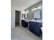Modern bathroom with double vanity and walk-in shower at 6891 W Via Del Sol Dr, Glendale, AZ 85310