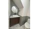 Modern powder room with green walls, geometric tile, and floating vanity at 6891 W Via Del Sol Dr, Glendale, AZ 85310
