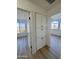 Hallway with linen closet and light wood floors at 6891 W Via Del Sol Dr, Glendale, AZ 85310
